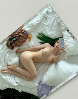 A woman with vibrant green hair lies nude on a white bed, taking a selfie with her phone; her body is curvy and she