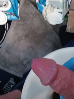 Person in black underwear with a red lipstick mark on their thigh.