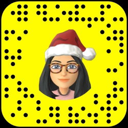 Animated avatar of a woman with long dark hair, glasses, and a Santa hat on a yellow Snapchat Snapcode background.