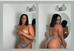 Curvy Black woman with glasses poses topless in a bathroom, wearing light blue thong underwear, facing and turning away