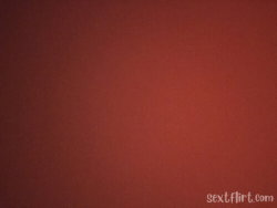 Solid reddish-brown background with no visible person or object.