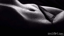 Close-up of a person's wet torso with visible nipple and zipper of dark clothing, high-contrast black and white